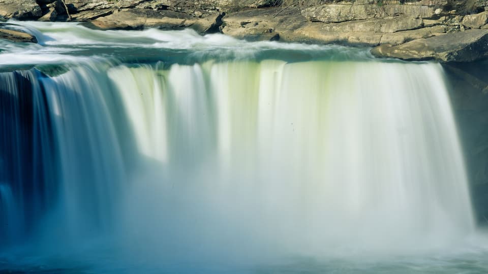 A waterfall cascading over rocky cliffs.