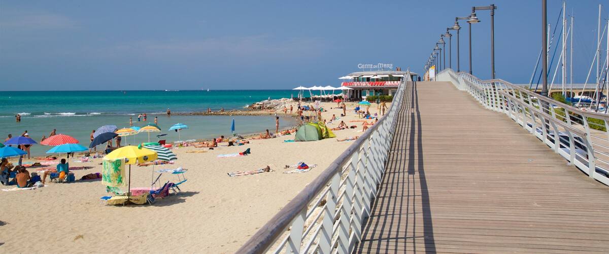 Cattolica which includes general coastal views, a beach and a bridge