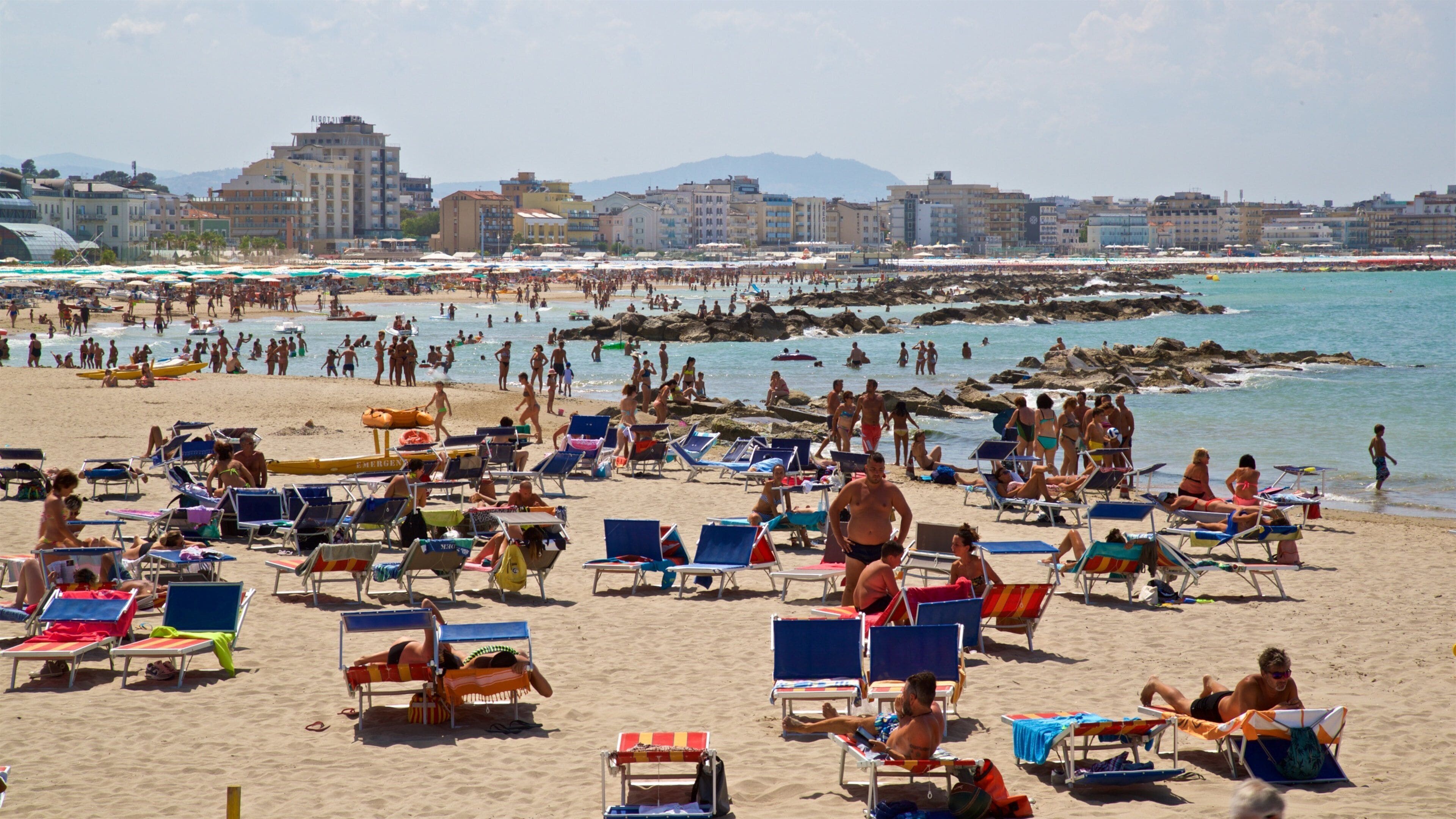 Cattolica which includes a beach, a coastal town and general coastal views