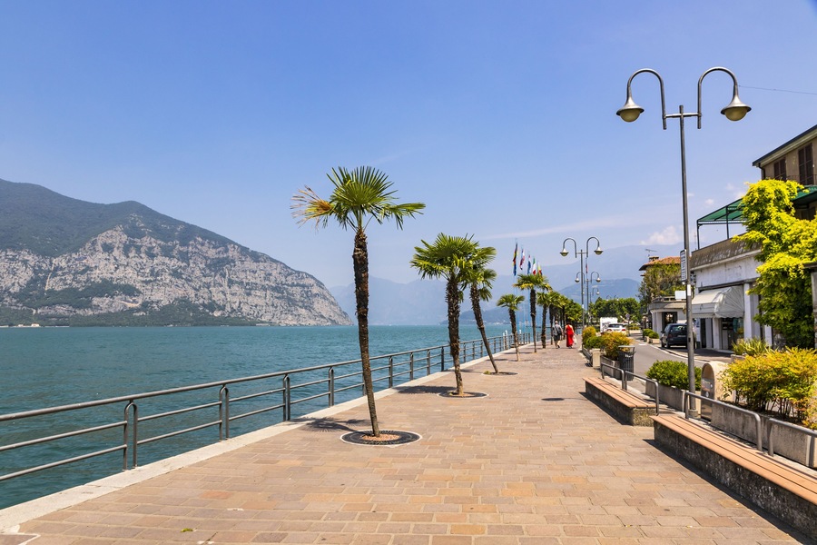 Promenade street in Iseo city on Iseo lake, Lombardy, Italy. Famous Italian resort. Lake Iseo (or Lago d'Iseo) is the 4th largest lake in Lombardy