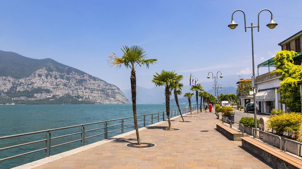 Promenade street in Iseo city on Iseo lake, Lombardy, Italy. Famous Italian resort. Lake Iseo (or Lago d'Iseo) is the 4th largest lake in Lombardy