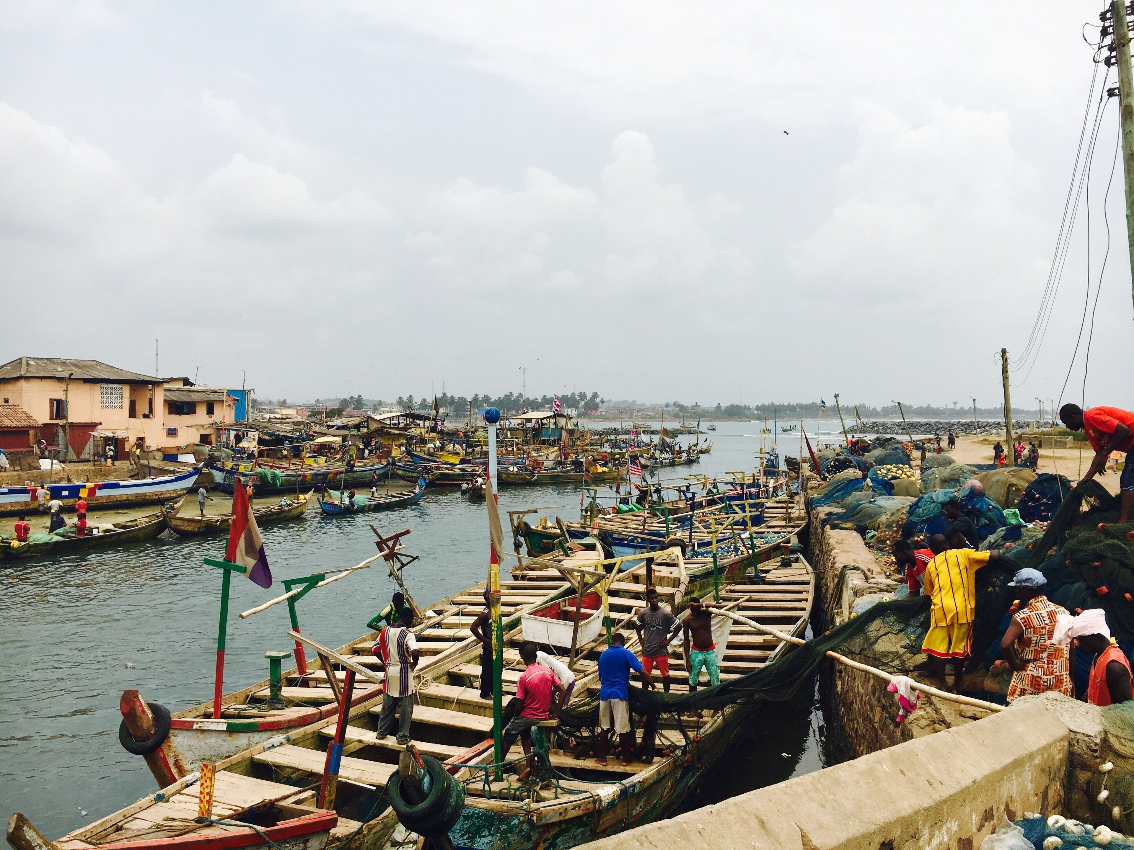 On the port of Cape Coast, Ghana. Fishermen preparing for a day at sea. #culture #ghana #elmina
