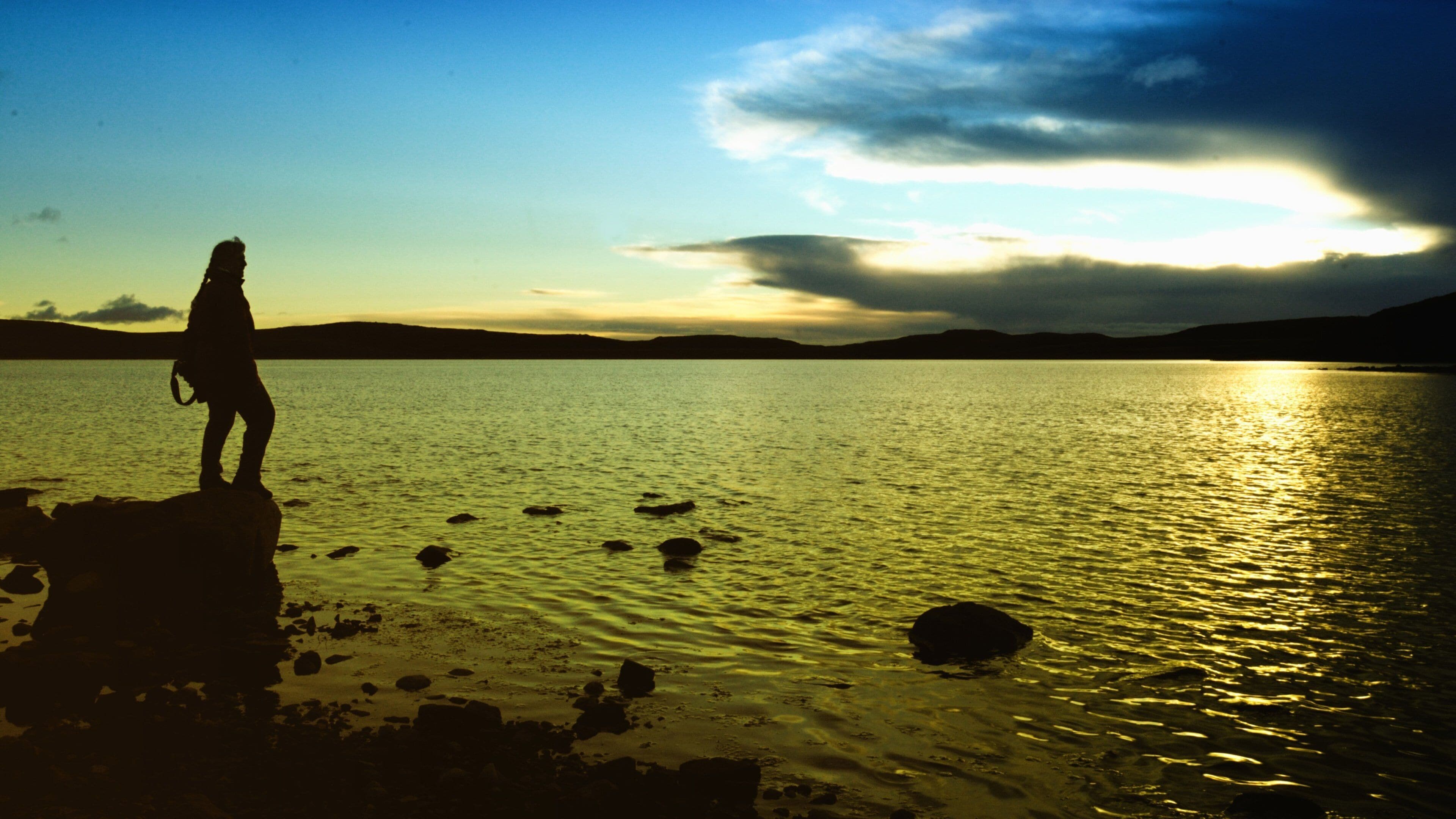 Nunavut featuring general coastal views and a sunset