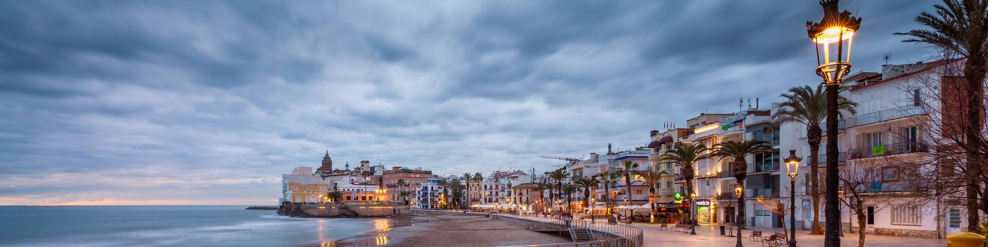 beach walk at sunset in playa san sebastian Sitges catalunya spain