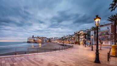 beach walk at sunset in playa san sebastian Sitges catalunya spain