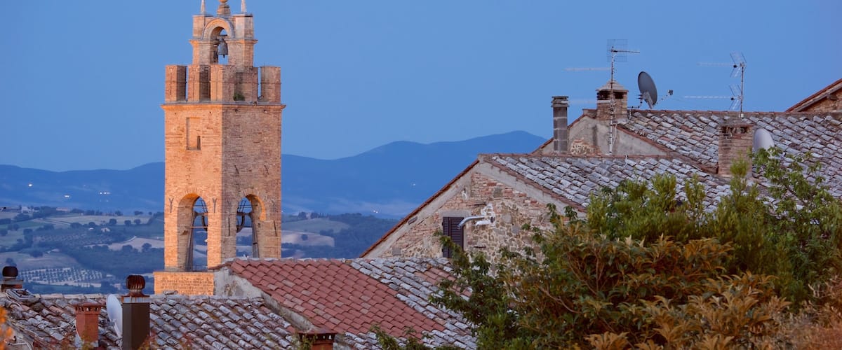 Montalcino which includes heritage architecture and a sunset