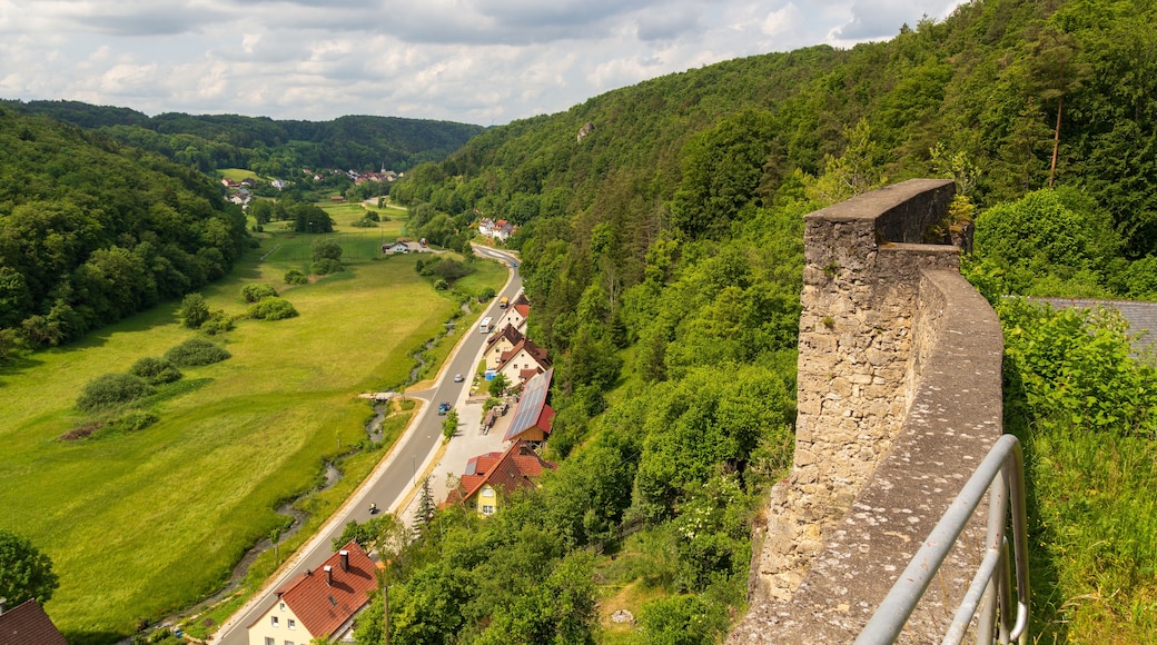 Ruins of Wolfsberg Castle and hill panorama with street near Obertrubach in Franconian Switzerland, Germany
