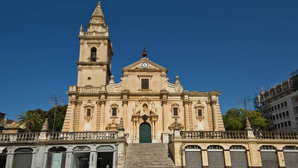 A historic church with a bell tower and a clock.