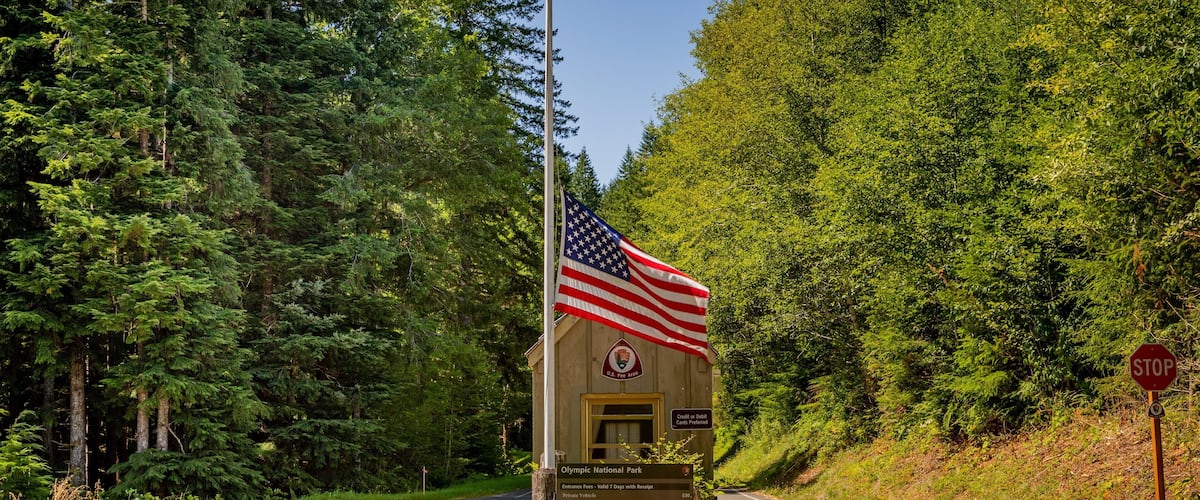 Olympic National Park featuring signage and tranquil scenes