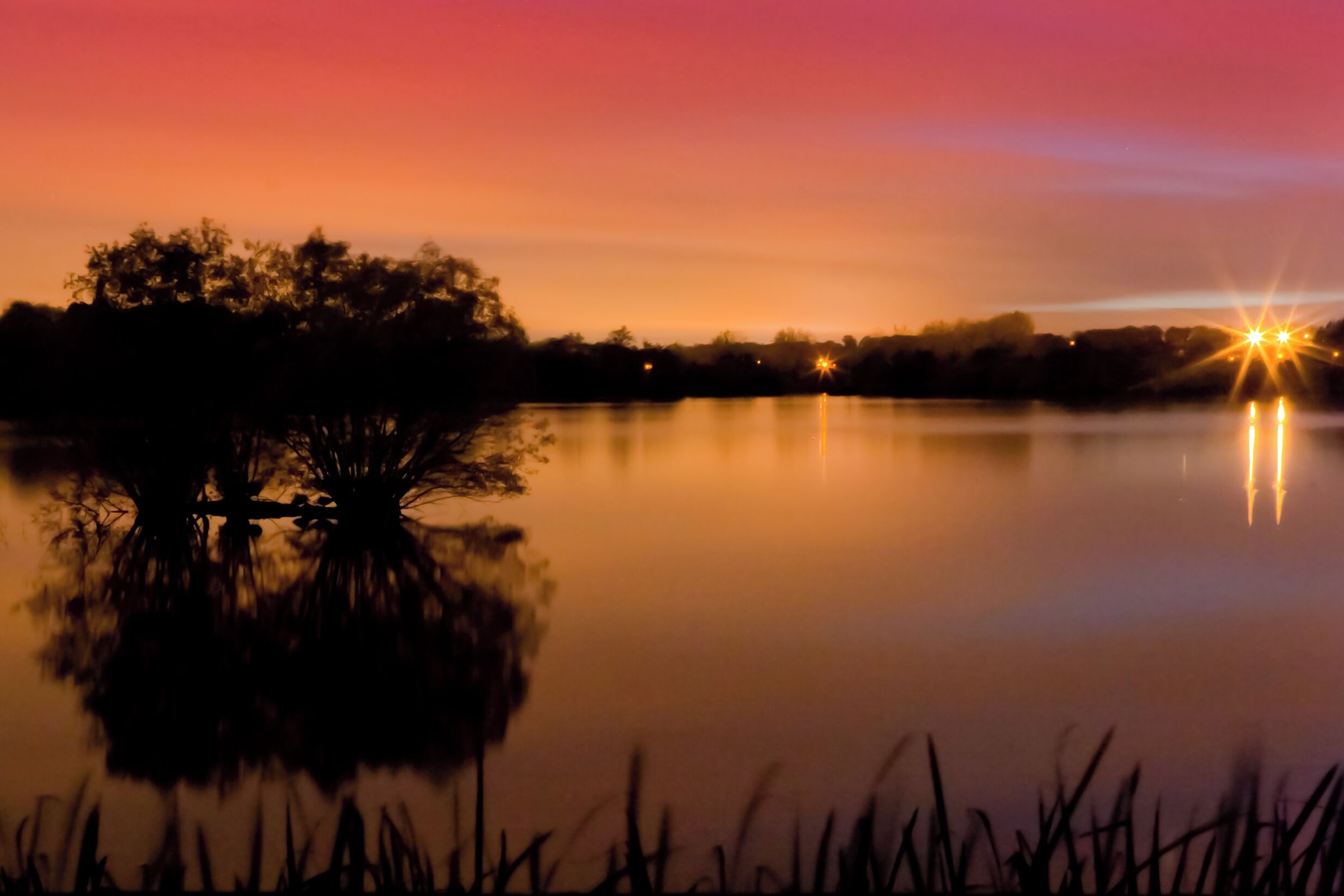 Unlike the tricky and lengthy noise reduction for www.flickr.com/photos/flatworldsedge/5126748478/ in this case I just maxed Lightroom's noise reduction and dropped the clarity. It's a 226 second exposure (F/22 ¦ ISO 100) from one of the bird hides on Stocker's Lake in Rickmansworth Aquadrome. There were hundreds of ducks floating about in the foreground, but none made sufficient impression against the bright reflected sky over the long exposure. Hope everyone is having a great week!
