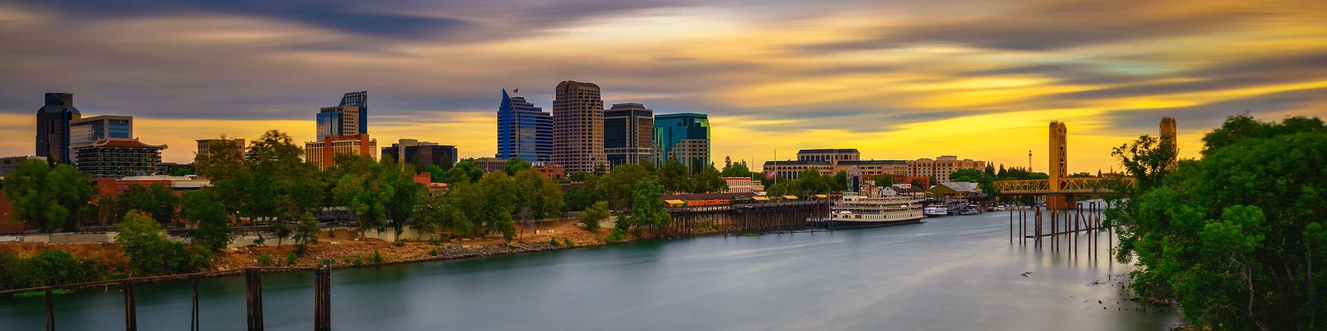 Sunset above Sacramento skyline, Sacramento River and Tower Bridge in California