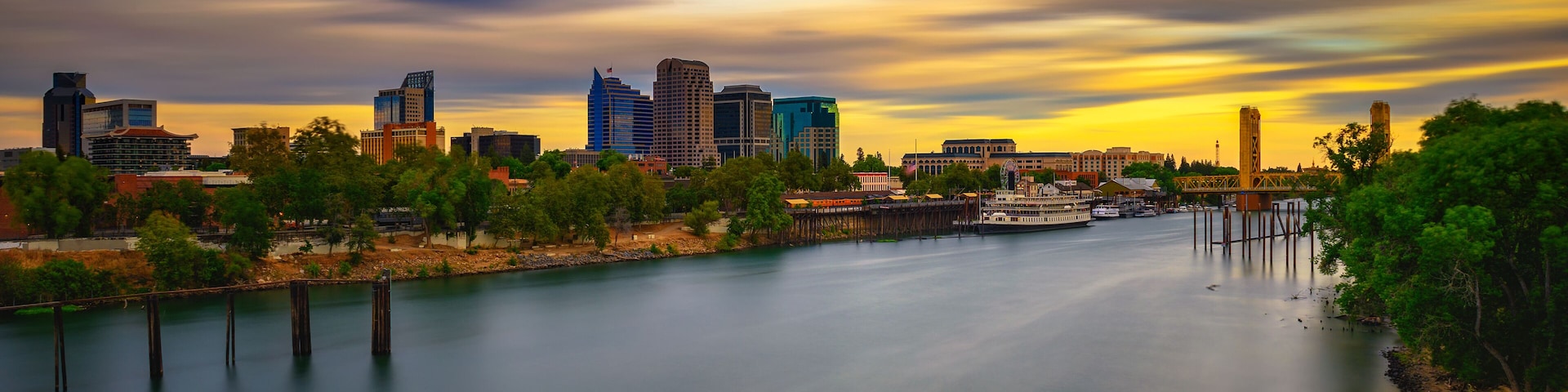 Sunset above Sacramento skyline, Sacramento River and Tower Bridge in California