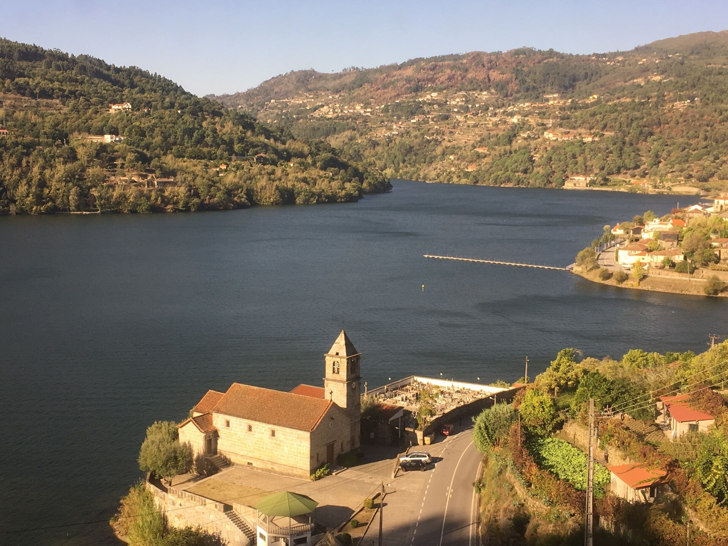 A river with a church and a bridge.