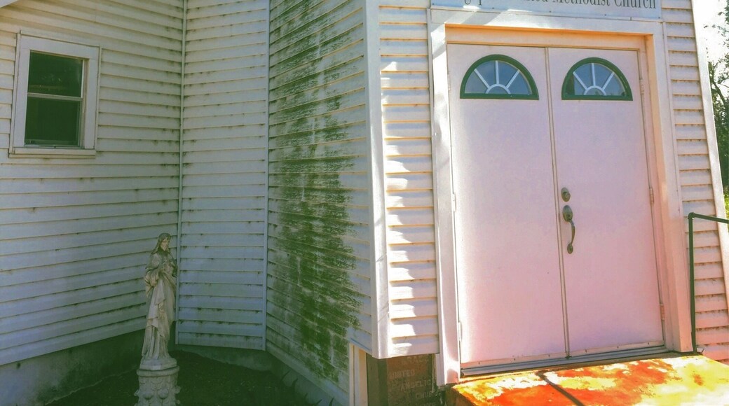 The Jesus statue and the old sidewalk caught my attention.
