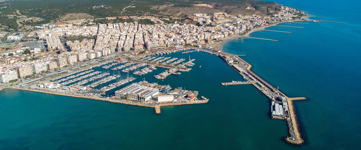 Aerial view of Santa Pola city. Panoramic aerial view of Port of Santa Pola. Costal Mediterranean city and famous travel destination in South of Spain. Panoramic view of all region. Alicante Province