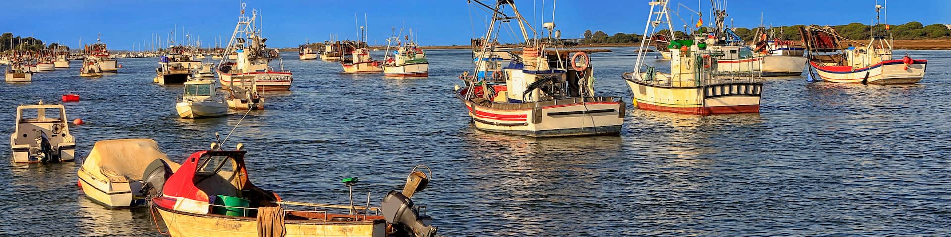 Fishing boats moored on the estuary of Punta Umbria, Huelva, Spain, Shutterstock ID 1265196874, Purchase Order: SP-1843, Order Number: SP-1843 Hotels.com Seasonality Project - Summer/Beach, Client/Lic