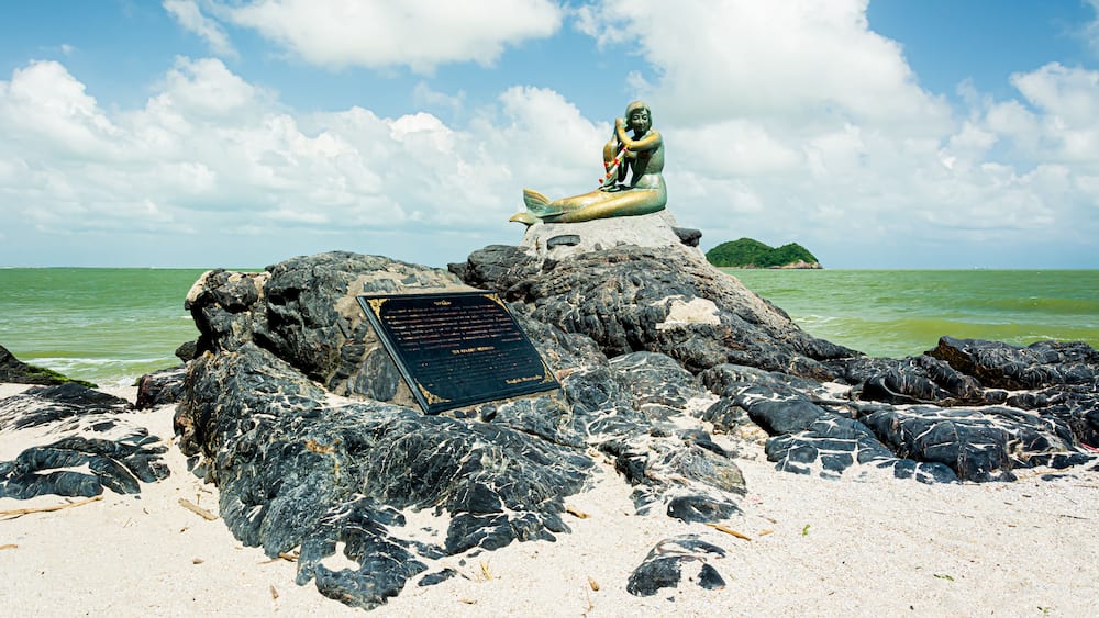 golden mermaid statues on Samila beach. Landmark of Songkla in Thailand.