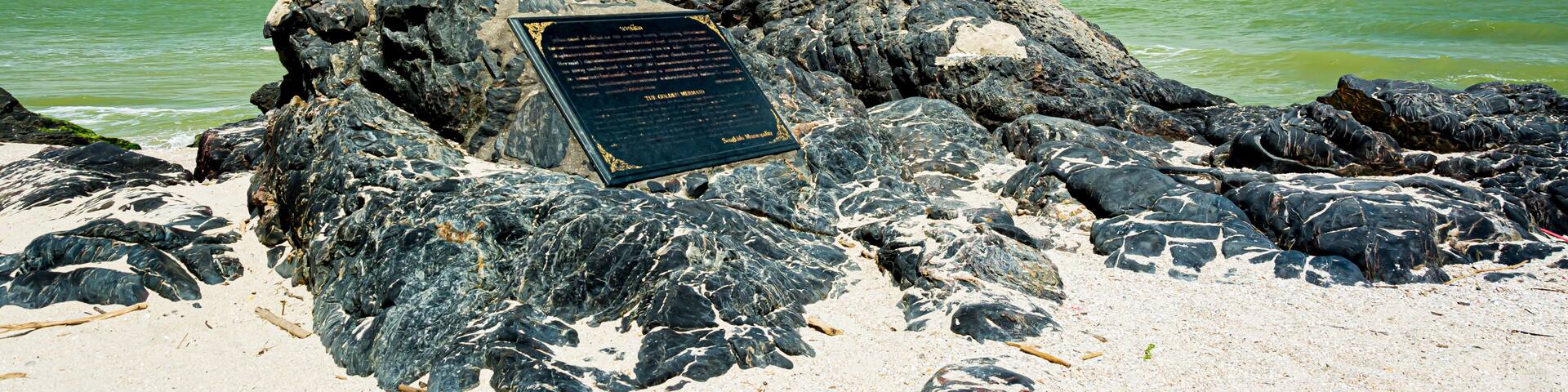 golden mermaid statues on Samila beach. Landmark of Songkla in Thailand.