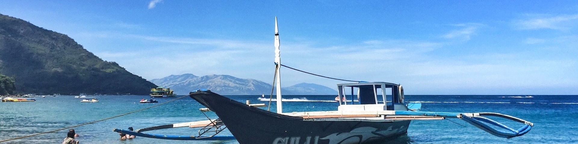 Puerto Galera is in the Island of Mindoro, about 3 hours away from Manila by bus and boat. The island might not have the same white sand and party scene of Boracay, but it's not less gorgeous! The picturesque hills around the beach with waterfalls and hiking trails, the crystal clear water and the chilled vibe, will make you fall in love with this place!