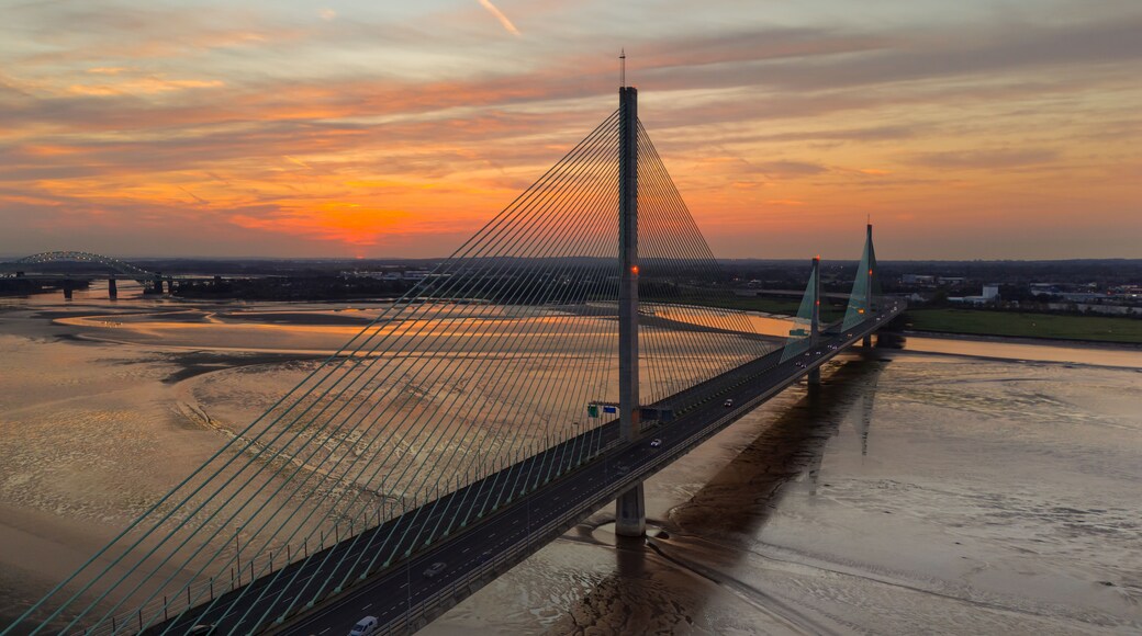 Liverpool, Merseyside, UK, September 18, 2024; aerial view of the Mersey Gateway toll bridge with stunning sun set over the River Mersey, Liverpool, UK.