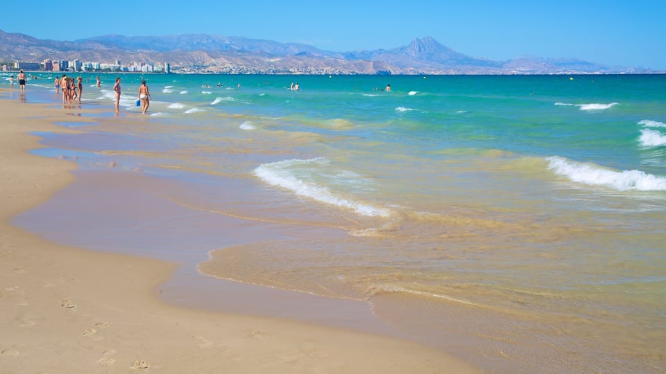 Playa de San Juan which includes general coastal views and a beach as well as a small group of people