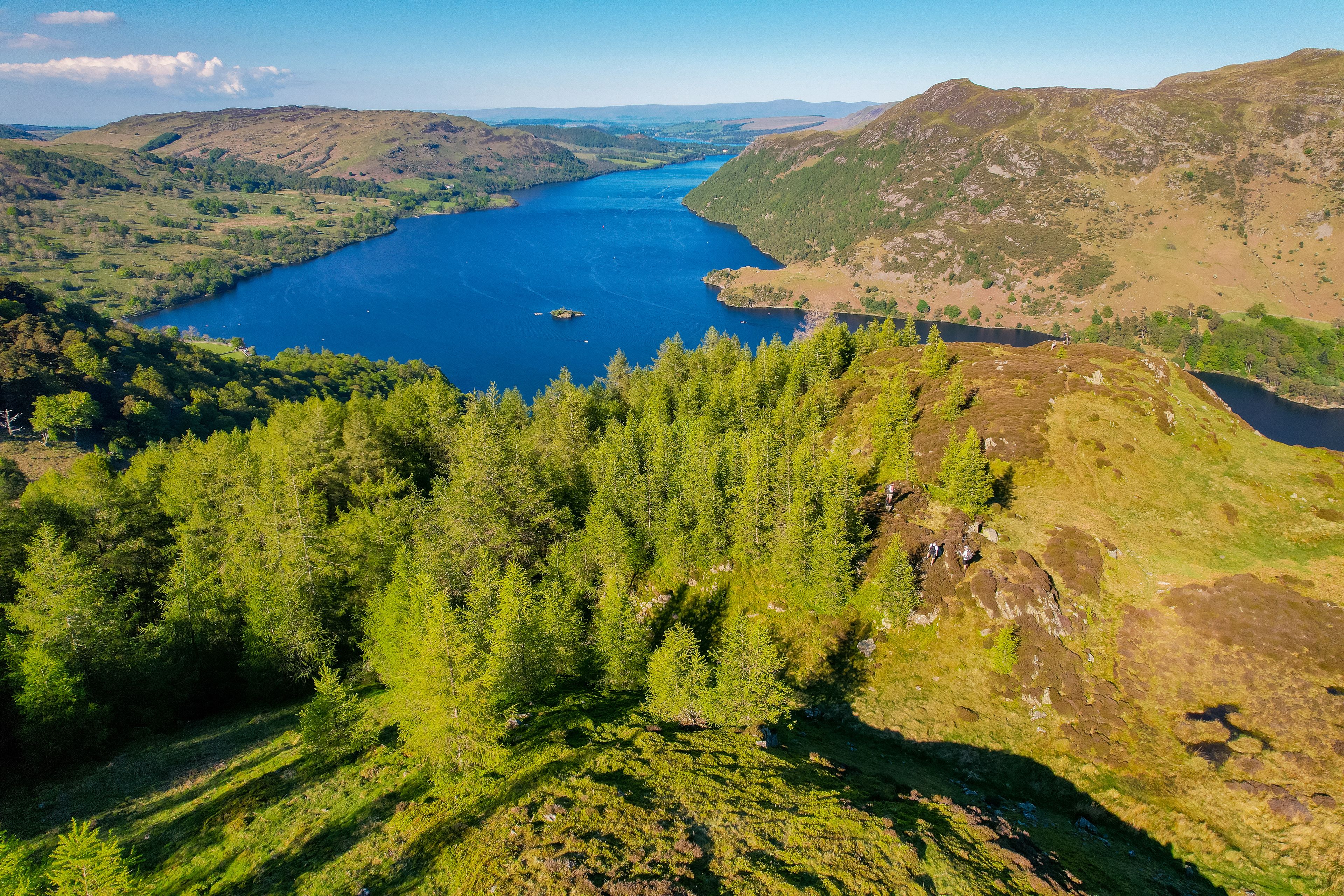 A river winding through a valley with dense forests on the hillsides.