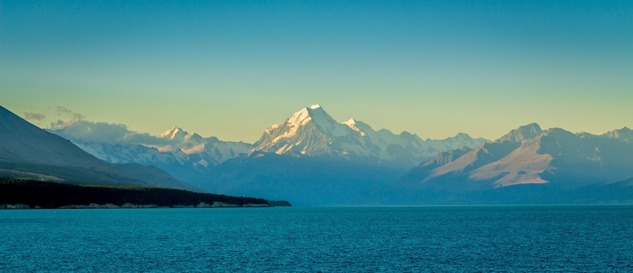 A view of Mount Cook at sunset from the shore at Lake Pukaki