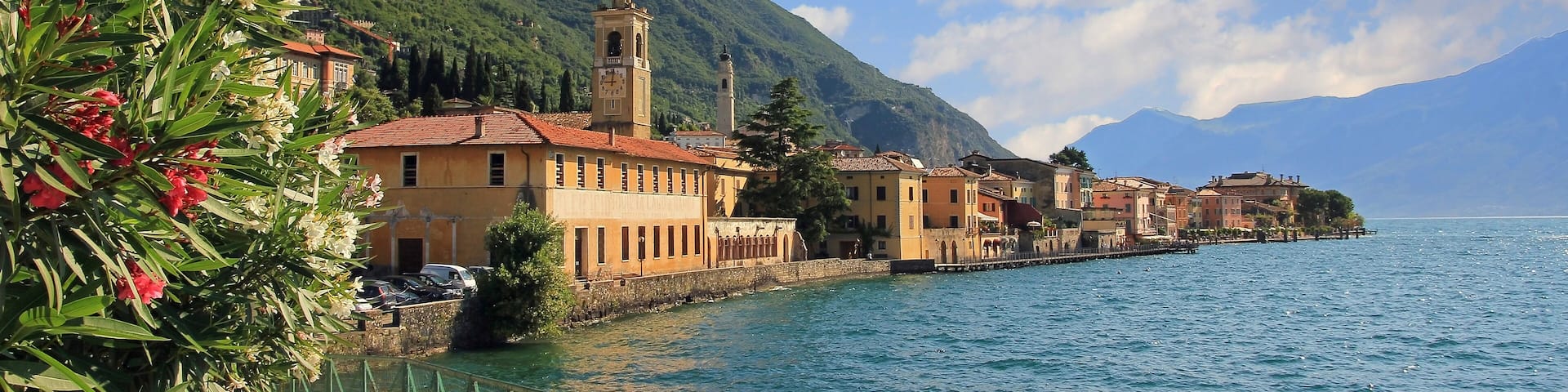 pictorial village gargnano, lago di garda, lakeside promenade with oleander and church; Shutterstock ID 278755586