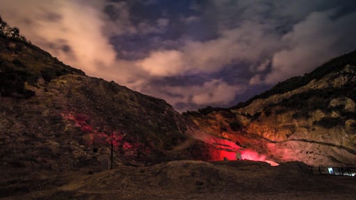 Solfatara (here, by night) is a shallow volcanic crater at Pozzuoli, near Naples, part of the Campi Flegrei volcanic area. It is a dormant volcano, which still emits jets of steam with sulfurous fumes. The name comes from the Latin, Sulpha terra, "land of sulfur", or "sulfur earth". It was formed around 4000 years ago and last erupted in 1198 with what was probably a phreatic eruption - an explosive steam-driven eruption caused when groundwater interacts with magma. The crater floor is a popular tourist attraction, as it has many fumaroles and mud pools. The area is well known for its bradyseism. The vapours have been used for medical purposes since Roman times.