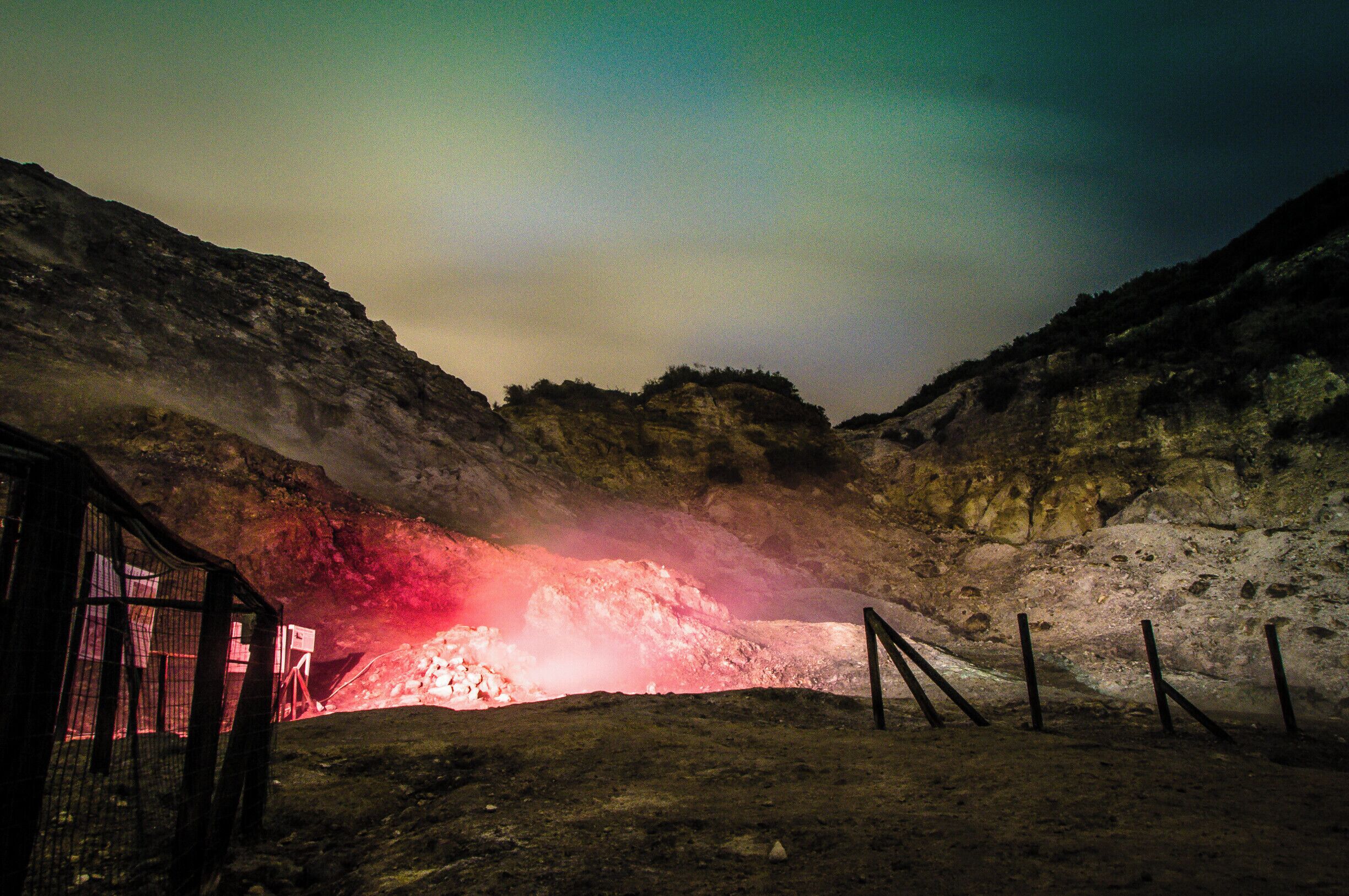 Solfatara (here, by night) is a shallow volcanic crater at Pozzuoli, near Naples, part of the Campi Flegrei volcanic area. It is a dormant volcano, which still emits jets of steam with sulfurous fumes. The name comes from the Latin, Sulpha terra, "land of sulfur", or "sulfur earth". It was formed around 4000 years ago and last erupted in 1198 with what was probably a phreatic eruption - an explosive steam-driven eruption caused when groundwater interacts with magma. The crater floor is a popular tourist attraction, as it has many fumaroles and mud pools. The area is well known for its bradyseism. The vapours have been used for medical purposes since Roman times.