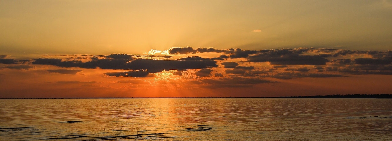 Sunset and grass on the Lake, Lake Pontchartrain, La.