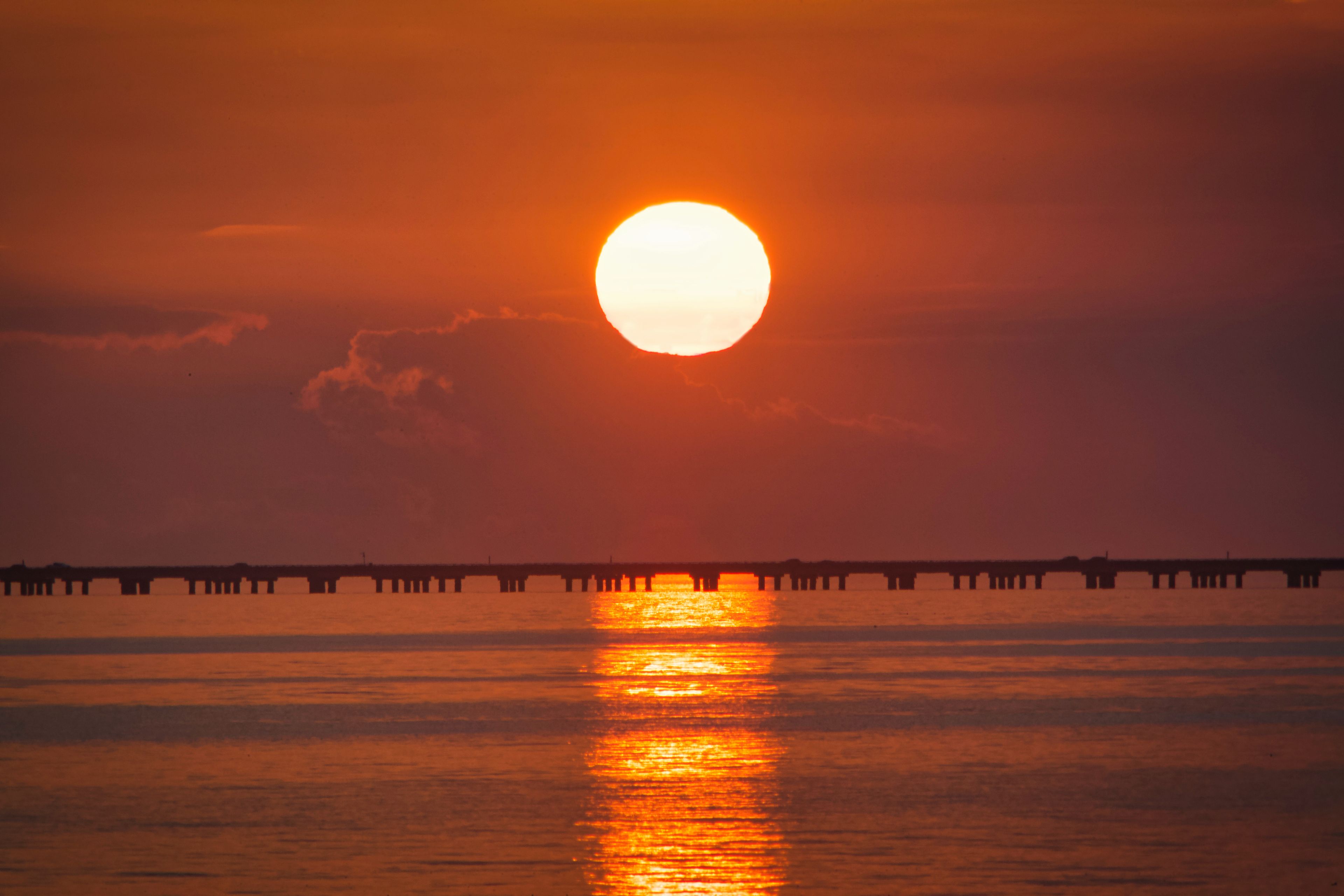 Lake Pontchartrain Causeway twin span bridges seen at sunset from Mandeville, Louisiana