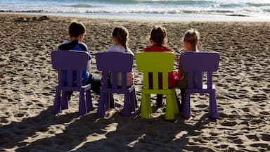 Alassio (SV), Italy - February 15, 2017: Childrens playing in beach in Alassio, Riviera dei Fiori, Savona, Liguria, Italy.