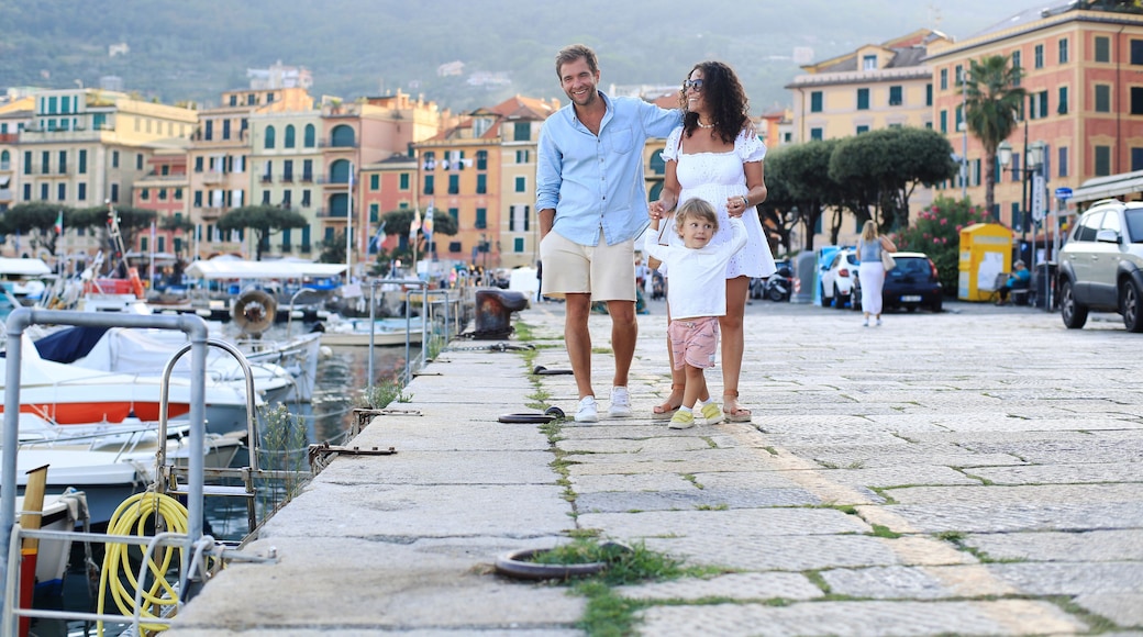 Young family walks along the waterfront during the holidays