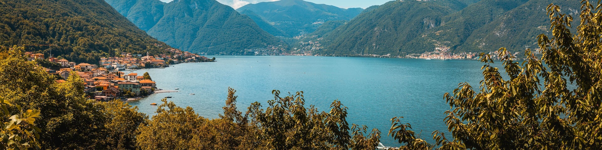 Stunning panoramic view of the picturesque lake como, nestled amidst the lush green mountains of the italian alps, creating a serene and captivating landscape. Location: Lezzeno, italy