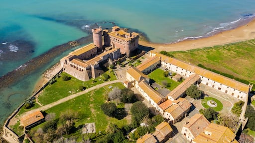 Aerial view of the Castle of Santa Severa, located in Santa Marinella in Lazio, in the Metropolitan City of Rome, Italy. It is a medieval castle built on the beach and overlooking the Tyrrhenian Sea.