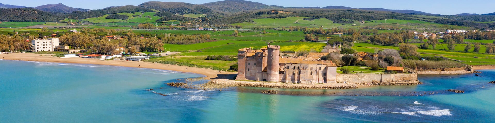 Aerial view of the Castle of Santa Severa, located in Santa Marinella in Lazio, in the Metropolitan City of Rome, Italy. It is a medieval castle built on the beach and overlooking the Tyrrhenian Sea.