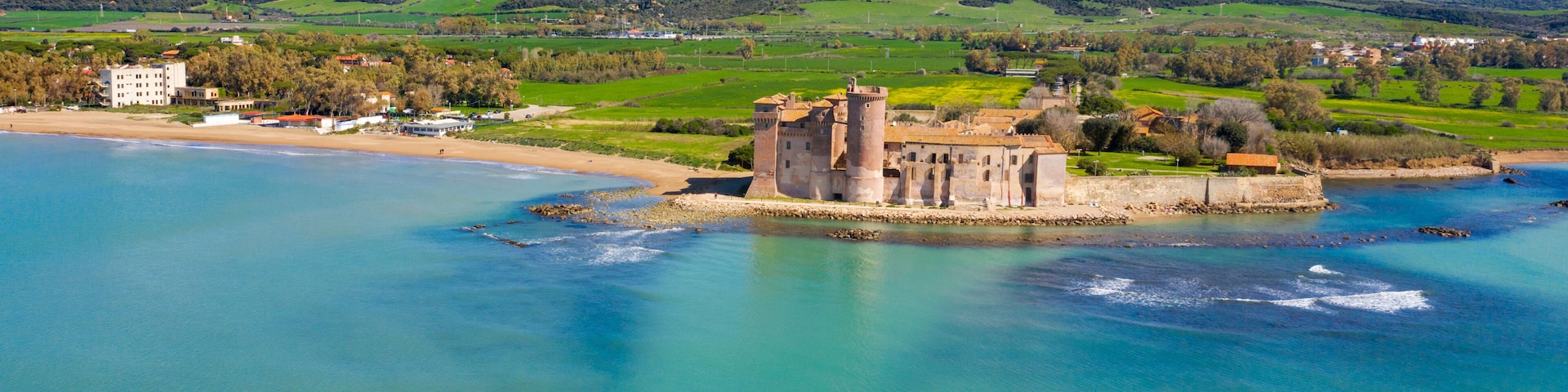 Aerial view of the Castle of Santa Severa, located in Santa Marinella in Lazio, in the Metropolitan City of Rome, Italy. It is a medieval castle built on the beach and overlooking the Tyrrhenian Sea.
