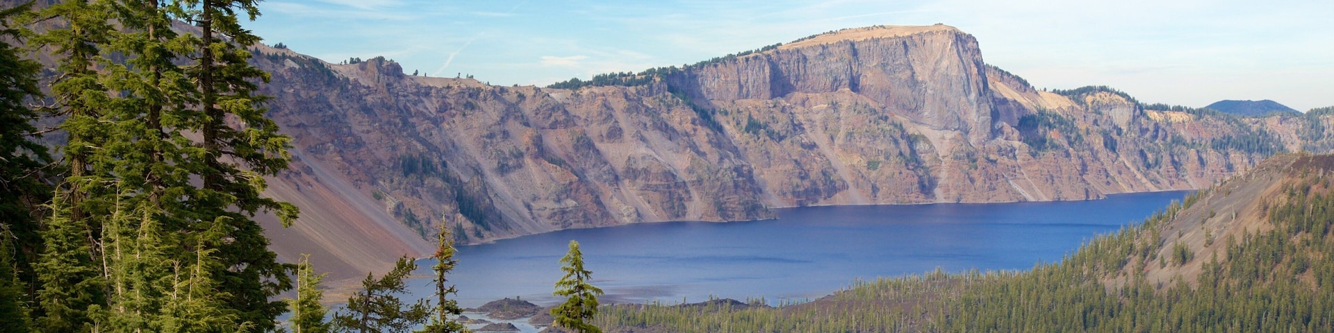 Crater Lake National Park which includes a lake or waterhole, landscape views and mountains
