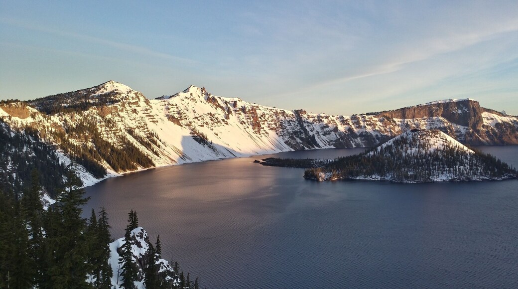 Wake up early and enjoy the sun dancing in the rim of Crater Lake until Wizard Island is lit. Visit in winter for less crowds but make sure you pack snowshoes. #snow
Check out more from my Crater Lake experience: http://www.angelatravels.com/2015/04/a-love-for-oregons-crater-lake-national-park/