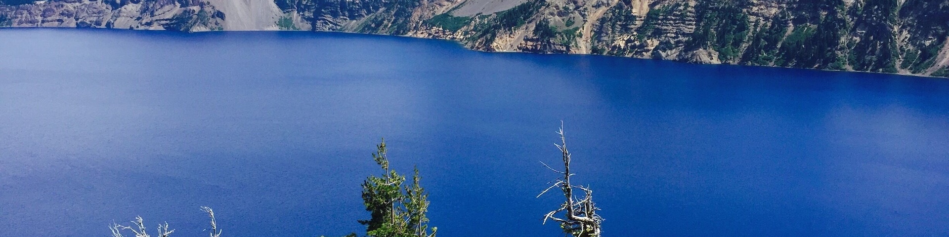 Deep , pure lake , indigo blue in color surrounded by cliffs with a violent volcanic past . It has to be experienced to feel it . #waterlust #craterlake #bluewaters #deepestlake #purest