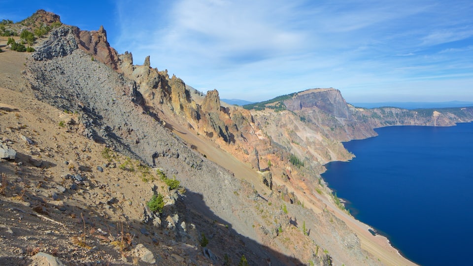 A rugged coastal cliff with a clear view of the ocean.