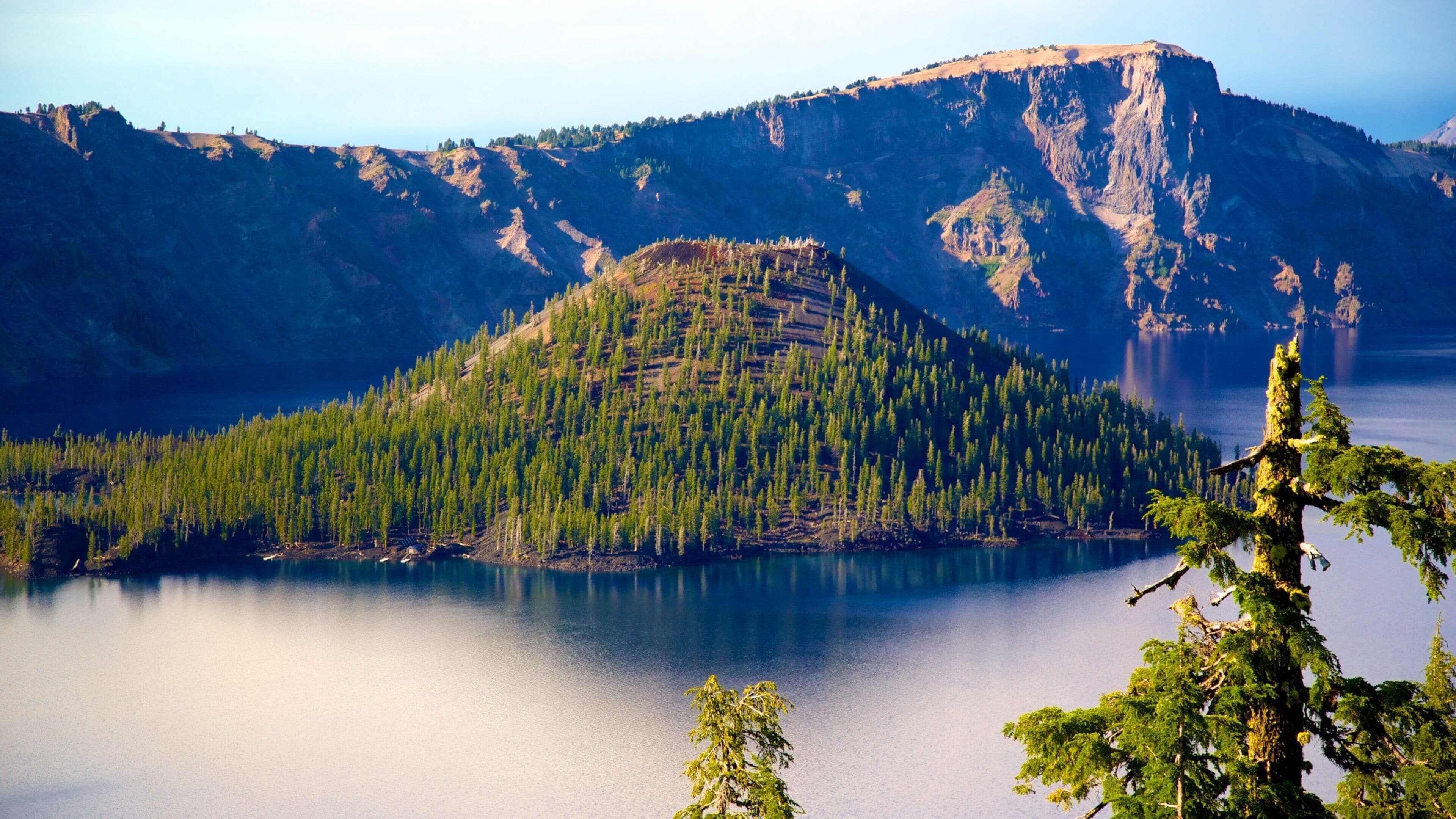 Crater Lake National Park which includes a lake or waterhole, mountains and landscape views