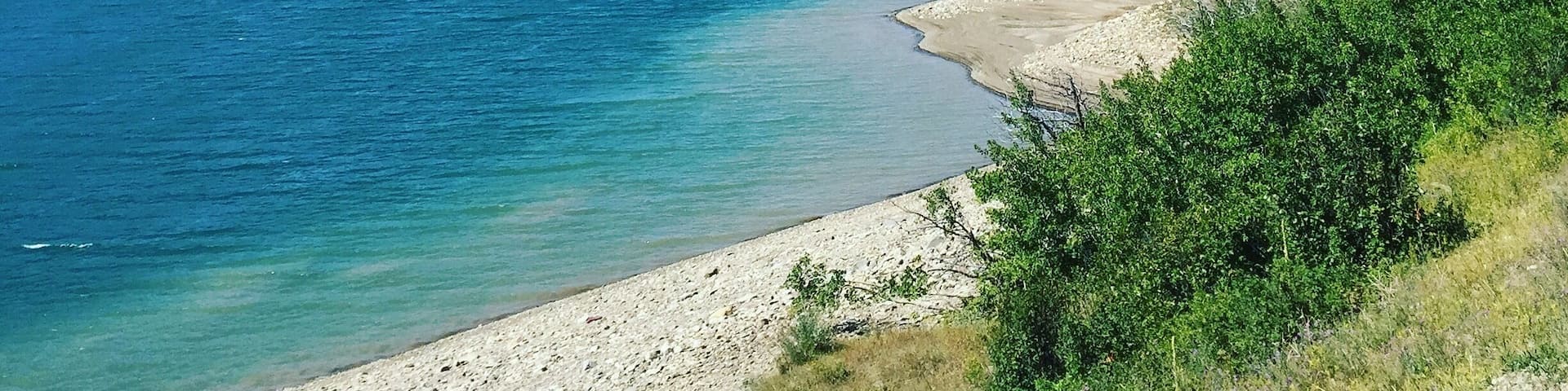 We stumbled upon this amazing view of the mountains and pristine blue water on our way to St. Mary Lake. #mountains #bluewater
