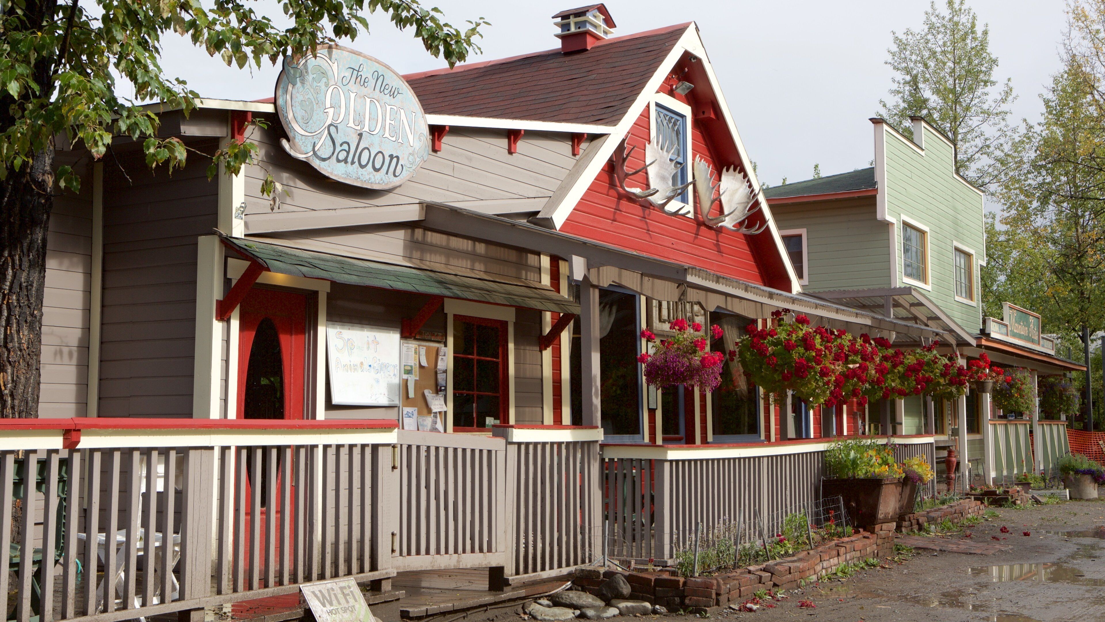 A building with a sign reading "The New Golden Saloon."