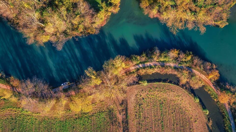 Aerial view of the Sile river at S. Elena di Silea (Treviso, Italy) at sunrise in autumn
