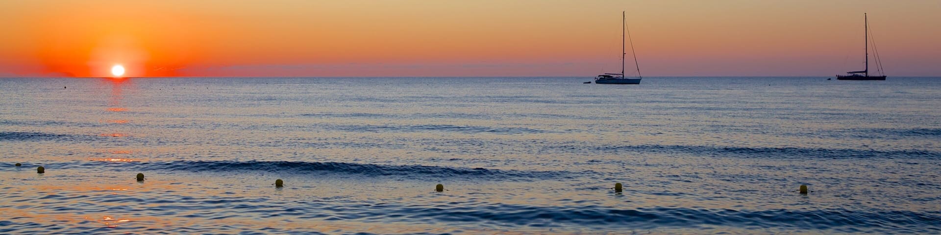 Cefalù showing a sunset and general coastal views