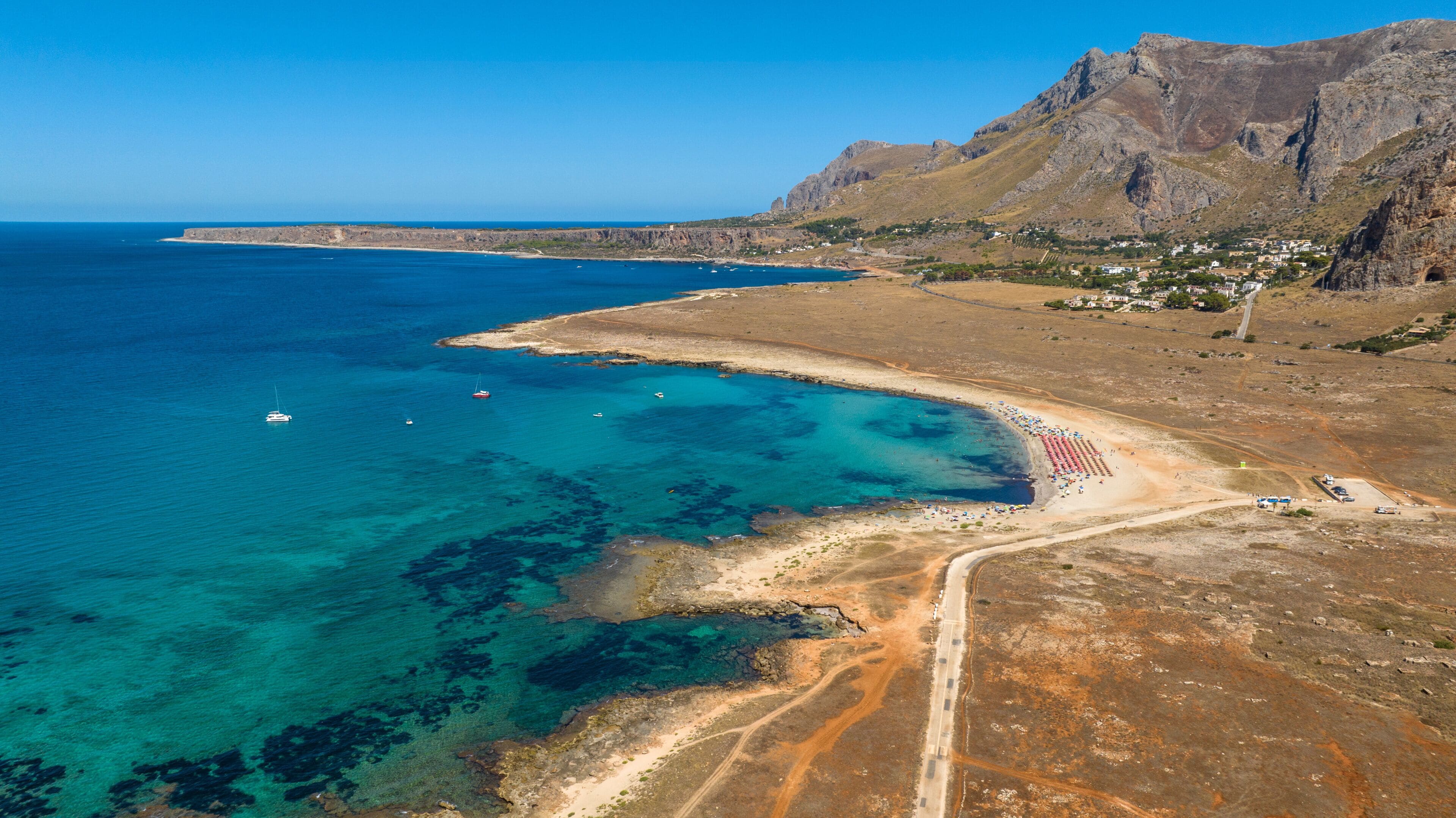 Aerial view of Macari Beach, located near San Vito Lo Capo, in province of Trapani, in Sicily, Italy. It is a beautiful coast with a turquoise and crystalline sea.