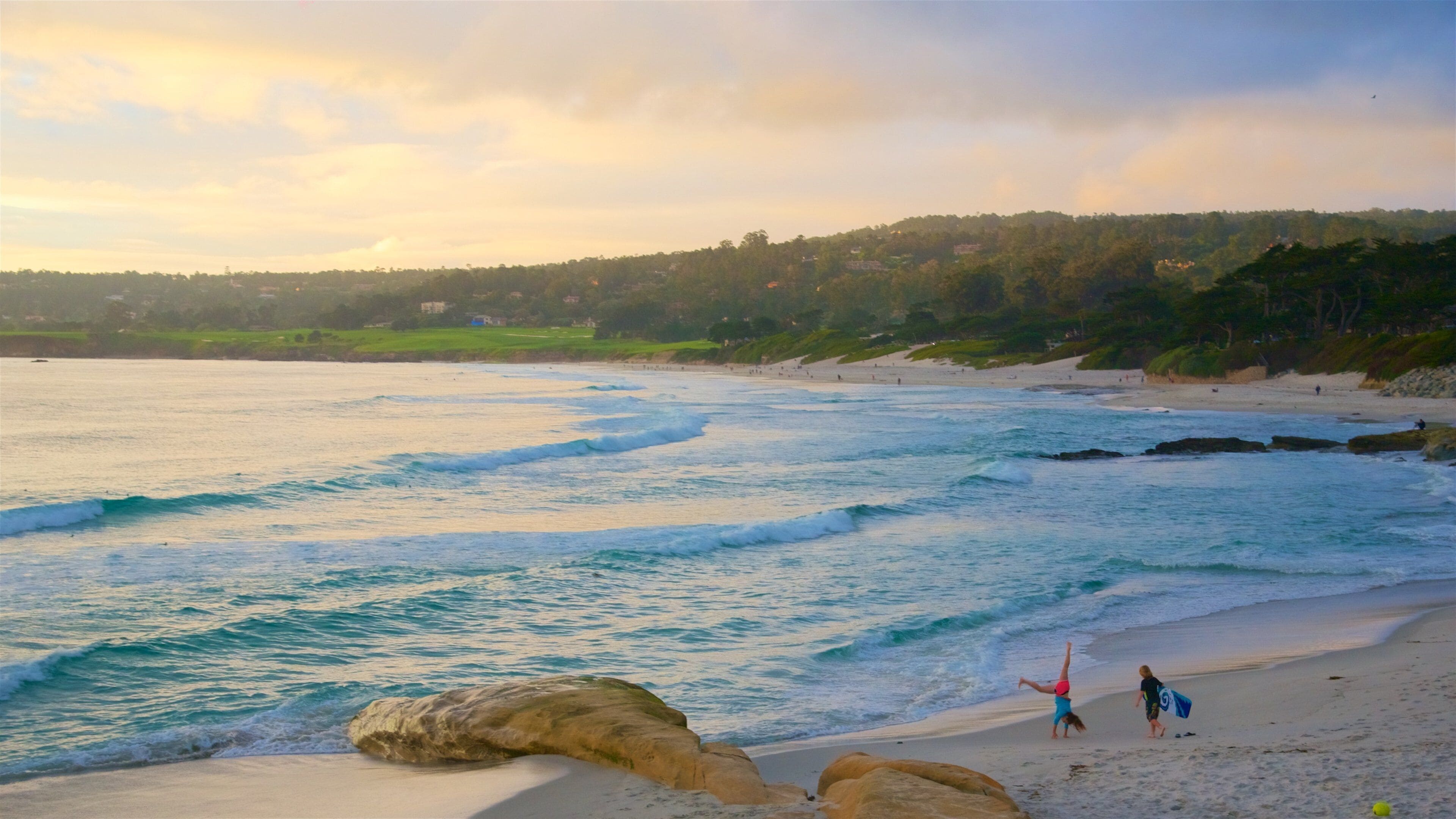 Carmel showing a sunset, general coastal views and a beach