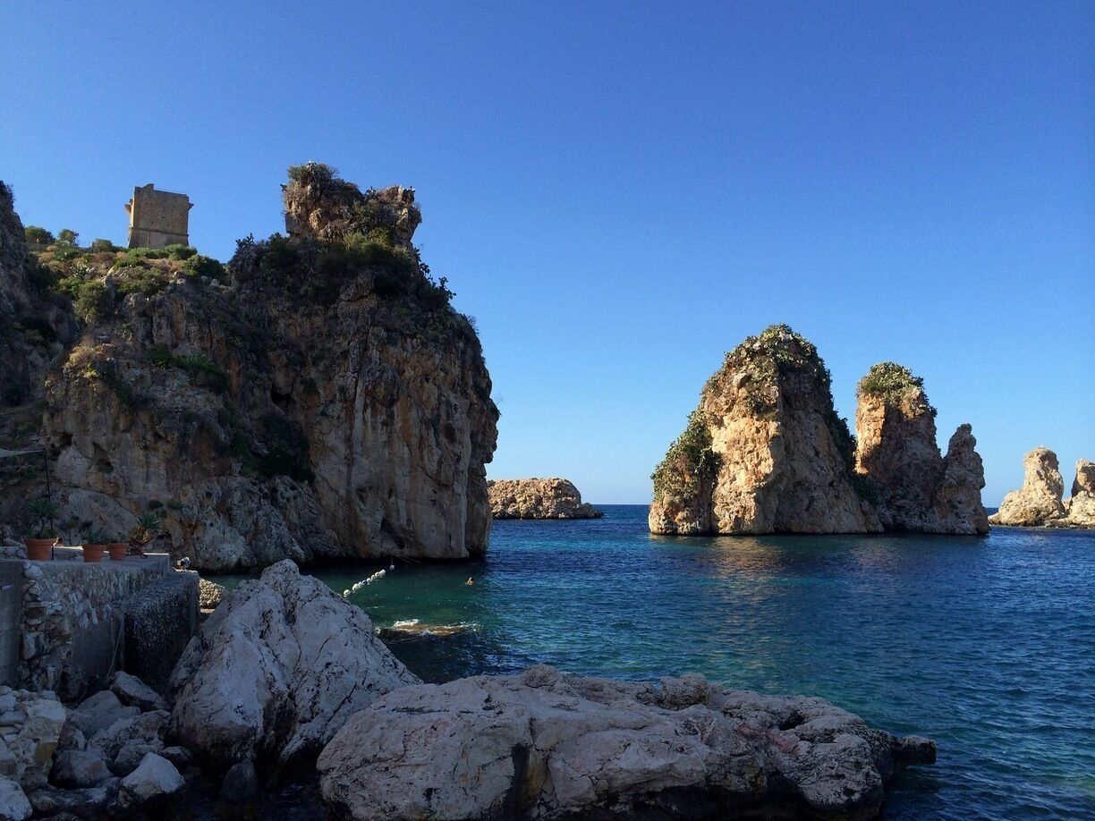 Lo Zingaro Nature rezerve.
West of Palermo, just after Castellammare del Golfo, the coastline becomes rugged, rocky and, in places, spectacular. That most natural of sculptors, the sea, has worked minor miracles, creating a myriad of coves, sea stacks and grottoes in the hard limestone cliffs.

